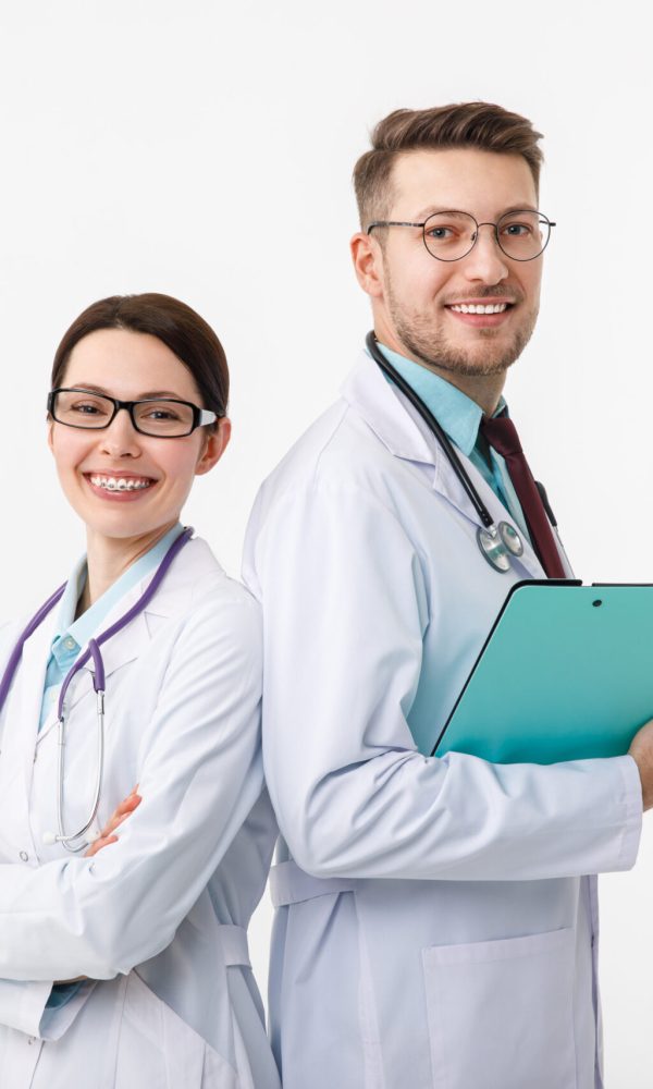 Happy doctors, man and woman isolated on white.
